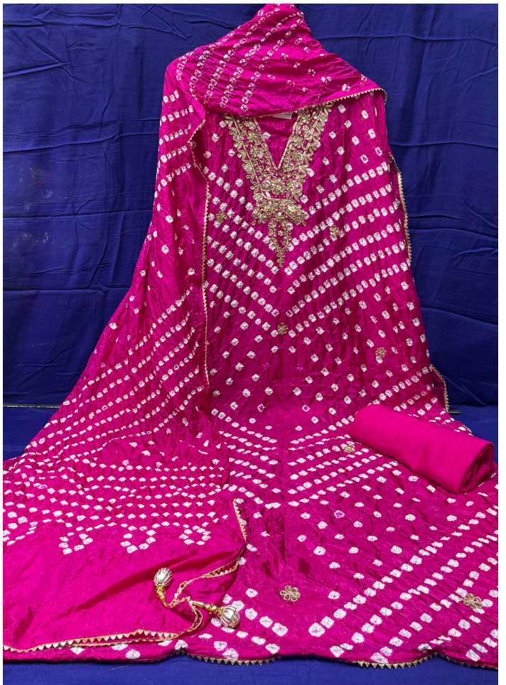 Pink embroidered traditional outfit on a blue background