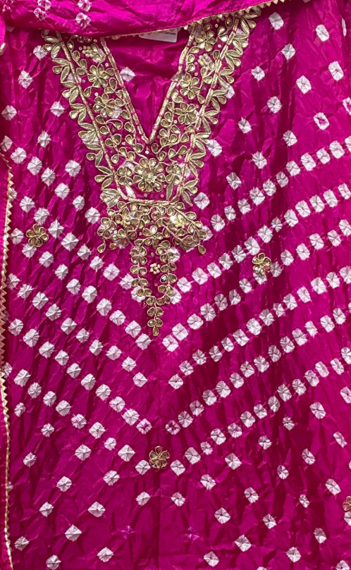 Pink traditional outfit with gold embroidery and embellishments
